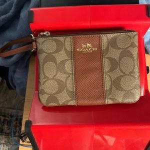 Coach wristlet in signature canvas